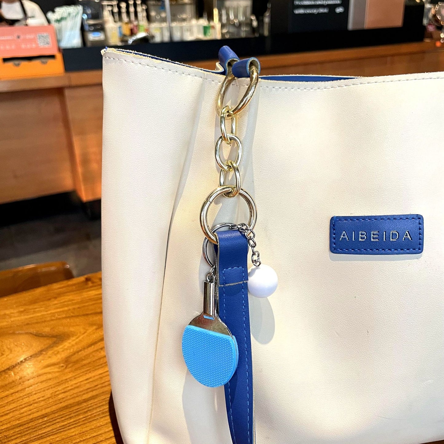 🏓 Mini Table Tennis Racket Keychain — Sporty Charm for Bags & Gifts